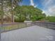 The home has a refinished wooden deck that overlooks the private back yard at 1159 Ragan Dr, Gastonia, NC 28054