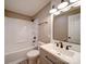 A bathroom featuring a tub shower, a light-up mirror, and stylish fixtures at 1159 Ragan Dr, Gastonia, NC 28054