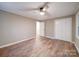 This bedroom has wood-look floors and a ceiling fan light fixture at 1159 Ragan Dr, Gastonia, NC 28054