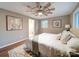 Comfortable main bedroom featuring a ceiling fan, large window and ensuite bathroom at 1159 Ragan Dr, Gastonia, NC 28054
