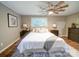 Comfortable main bedroom featuring a ceiling fan, large window and wood flooring at 1159 Ragan Dr, Gastonia, NC 28054