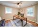 Bright office space featuring hardwood floors, neutral paint, and two windows at 1159 Ragan Dr, Gastonia, NC 28054