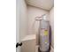 A utility room with a newer model water heater and a small storage nook at 1159 Ragan Dr, Gastonia, NC 28054