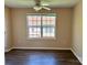Bright bedroom features neutral walls, window and ceiling fan at 117 24Th Nw St # 41, Hickory, NC 28601