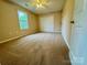 Bedroom featuring neutral walls, carpet, window and ceiling fan at 117 24Th Nw St # 41, Hickory, NC 28601