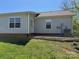 Back exterior view features the air conditioner, patio area, and yard at 117 24Th Nw St # 41, Hickory, NC 28601