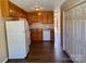 Functional kitchen with wood cabinets and white appliances, providing a practical space for cooking and storage at 117 24Th Nw St # 41, Hickory, NC 28601