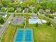 Aerial view of the community pool and tennis courts shows neighborhood amenities at 130 Weeping Spring Dr, Mooresville, NC 28115