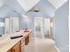 Bright bathroom with double sinks, vanity, with an arched ceiling and a sailboat decoration at 130 Weeping Spring Dr, Mooresville, NC 28115