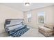Bright bedroom with sun tanning machine, comfortable chair, and natural lighting at 130 Weeping Spring Dr, Mooresville, NC 28115