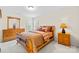 Comfortable bedroom features wood furniture and a window allowing for natural light at 130 Weeping Spring Dr, Mooresville, NC 28115