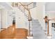 Inviting home foyer featuring a staircase, hardwood floors, and neutral decor at 130 Weeping Spring Dr, Mooresville, NC 28115