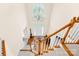 Elegant foyer with staircase, hardwood floors, large chandelier, and lots of natural light at 130 Weeping Spring Dr, Mooresville, NC 28115