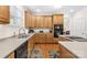 Well-equipped kitchen with hardwood floors, a central island, and plenty of cabinet space at 130 Weeping Spring Dr, Mooresville, NC 28115