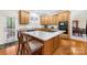Functional kitchen featuring a central island with seating and modern appliances at 130 Weeping Spring Dr, Mooresville, NC 28115