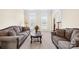 Cozy living room with comfortable seating and ample natural light, ideal for relaxation at 130 Weeping Spring Dr, Mooresville, NC 28115