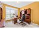 Home office featuring a wooden desk, built-in shelves, and a large window with natural light at 130 Weeping Spring Dr, Mooresville, NC 28115