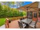 Outdoor patio area complete with dining table, chairs and outdoor umbrella at 130 Weeping Spring Dr, Mooresville, NC 28115