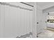 Clean bathroom with a white shower curtain and tile, offering a glimpse into the adjacent bedroom at 1330 Dean St, Charlotte, NC 28216