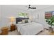 Bright bedroom with hardwood floors, a ceiling fan, and natural light at 1330 Dean St, Charlotte, NC 28216