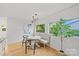 Bright dining area featuring a modern light fixture and plenty of natural light at 1330 Dean St, Charlotte, NC 28216