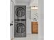 Convenient laundry area with stacked washer and dryer, and a utility sink at 1330 Dean St, Charlotte, NC 28216