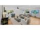 Open-concept living space with hardwood flooring, a ceiling fan, and a dining area at 1330 Dean St, Charlotte, NC 28216