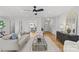Bright living room with wood floors, black accent furniture, and comfortable furnishings at 1330 Dean St, Charlotte, NC 28216