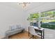 Sunlit home office with stylish bench seating, hardwood floors, and a bright view to the outdoors at 1330 Dean St, Charlotte, NC 28216