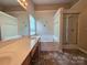 A bathroom featuring a double sink vanity, bathtub, shower, and tile flooring at 13409 Glasgow Green Ln, Charlotte, NC 28213