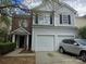 Charming two-story home featuring a two-car garage and a combination of brick and vinyl siding at 13409 Glasgow Green Ln, Charlotte, NC 28213