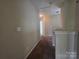 Hallway with carpeting, lighting, and access to various rooms at 13409 Glasgow Green Ln, Charlotte, NC 28213