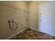 Functional laundry room with shelving and hookups, ready for your washer and dryer at 13409 Glasgow Green Ln, Charlotte, NC 28213