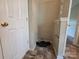 A compact laundry area featuring durable flooring and access to essential utilities at 13409 Glasgow Green Ln, Charlotte, NC 28213