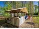 Outdoor bar in backyard, perfect for entertaining guests at 139 Autumn Grove Ln, Mooresville, NC 28115