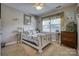 Charming bedroom features a decorative bed frame, a cozy window nook, and soft colors, creating a peaceful retreat at 139 Autumn Grove Ln, Mooresville, NC 28115