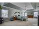 Bright, spacious main bedroom featuring large windows, tray ceiling, and neutral carpet at 139 Autumn Grove Ln, Mooresville, NC 28115