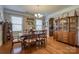 Elegant dining room features hardwood floors, a chandelier, and traditional furniture for a warm and inviting space at 139 Autumn Grove Ln, Mooresville, NC 28115