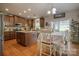 Spacious kitchen boasts stainless steel appliances, granite countertops, a center island, and a breakfast nook at 139 Autumn Grove Ln, Mooresville, NC 28115