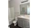 Bathroom with tub-shower, tile flooring, toilet, vanity, and a sink with brushed-metal faucet at 14208 Castle Abbey Ln, Charlotte, NC 28277