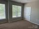 Bedroom featuring natural light, a closet, and neutral carpeting at 14208 Castle Abbey Ln, Charlotte, NC 28277