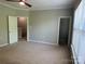 Comfortable bedroom featuring a closet and access to a staircase at 14208 Castle Abbey Ln, Charlotte, NC 28277