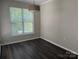 Dining area with hardwood floors and a bright window at 14208 Castle Abbey Ln, Charlotte, NC 28277