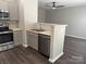 Kitchen area with stainless steel appliances and an eat-at counter overlooking the living area at 14208 Castle Abbey Ln, Charlotte, NC 28277