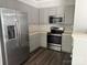 Kitchen featuring stainless steel appliances and light-colored cabinets at 14208 Castle Abbey Ln, Charlotte, NC 28277