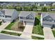 Aerial view of the property showcasing its well-manicured lawn, landscaping, and neighborhood setting at 1717 Mill Creek Sw Ln, Concord, NC 28025