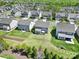 Aerial view showcasing the neighborhood, large green lawns, and well-maintained exteriors at 1717 Mill Creek Sw Ln, Concord, NC 28025