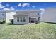 Spacious backyard featuring a covered patio area, perfect for relaxation and outdoor activities at 1717 Mill Creek Sw Ln, Concord, NC 28025