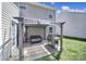 Cozy backyard patio with pergola, seating, and grill, perfect for outdoor entertaining at 1717 Mill Creek Sw Ln, Concord, NC 28025