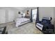 Comfortable bedroom featuring a ceiling fan, natural light, and neutral decor at 1717 Mill Creek Sw Ln, Concord, NC 28025